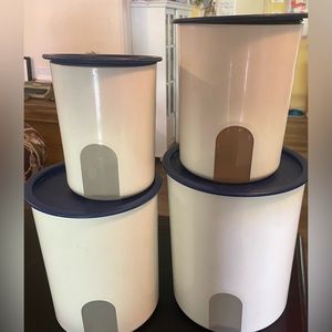 Blue and white vintage Tupperware canisters.